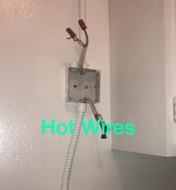 Exposed live wiring found during a home inspection